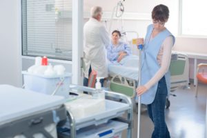 A woman cleans the floor of a hospital room. Progressive's track record of hospital cleaning is only bolstered by its HCAHPS survey Scores