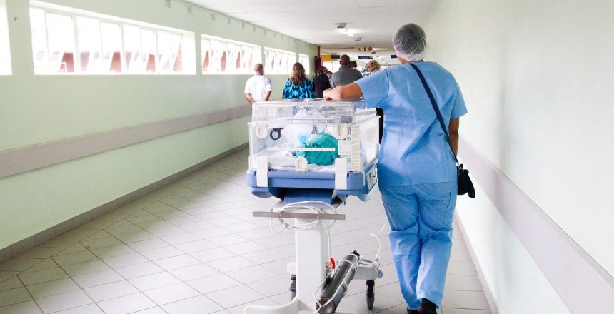 Poor hospital cleanliness affects everybody, especially newborns struggling during early stages of development. A nurse walks a baby to the NICU ward.
